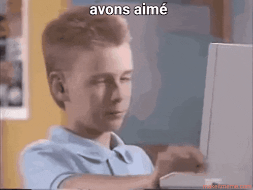 a boy is typing on a laptop with the words avons aimé written above him
