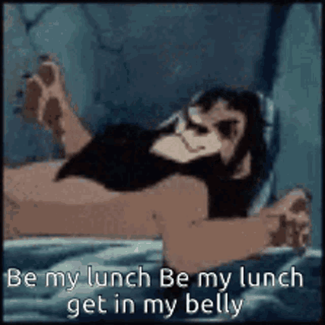 a cartoon of a monkey laying on a bed with the words `` be my lunch be my lunch get in my belly ''