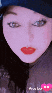 a close up of a woman 's face with a heart that says " arce lop " on it
