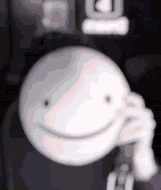 a close up of a person 's face with a smile on it .