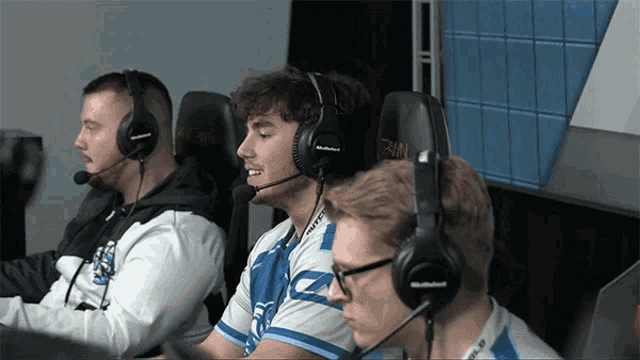 a group of people wearing headphones with the word team on the back