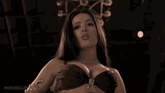 a movie clip from movieclips.com shows a woman with a snake around her arm