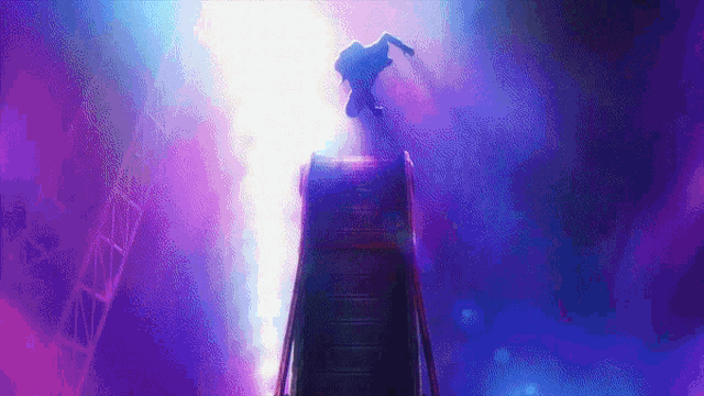 a person is standing on top of an escalator in a dark room with purple lights behind them .