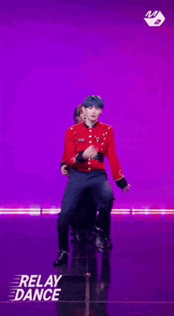 a group of men are dancing in front of a purple background with relay dance written on the bottom