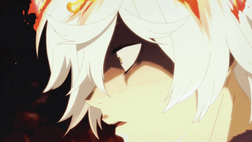 a close up of a person 's face with fire coming out of it