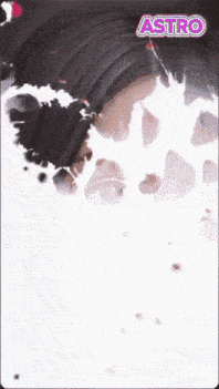 a close up of a woman 's face with the word astro on the bottom right