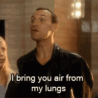 a man in a leather jacket is standing next to a woman and says i bring you air from my lungs .