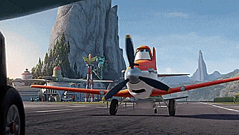 a cartoon plane is on a runway in front of a mountain