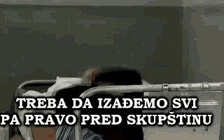 a man is laying in a hospital bed with the words trzeba da izadomo svi pa pravo pred skupštinu .