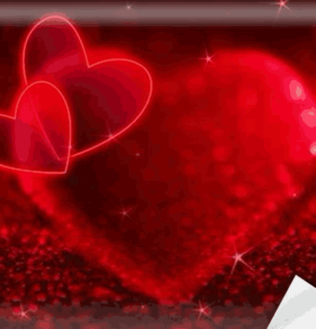 two red hearts on a red background with sparkles .