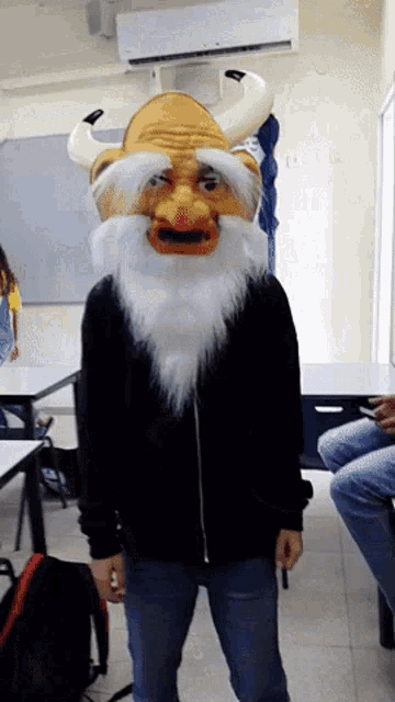 a man wearing a mask with horns and a beard