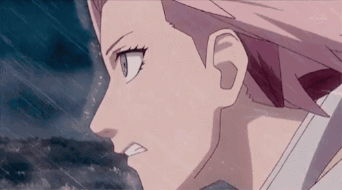 a close up of a person 's face with a serious look on her face .
