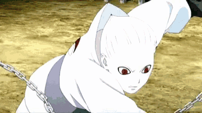 a white anime character with red eyes is chained to a wall .