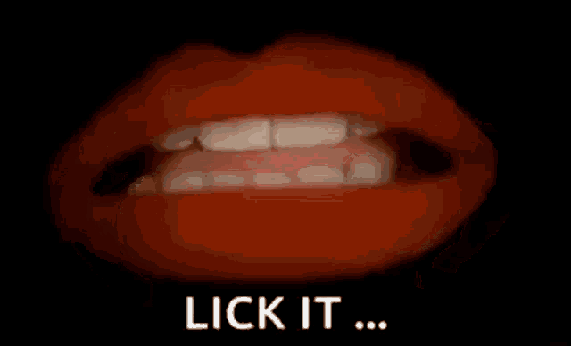 a close up of a person 's mouth with the words `` lick it '' written in white letters .