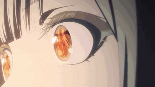 a close up of a girl 's eye with a reflection of a person