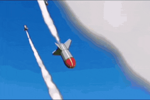 a rocket is flying through a blue sky with smoke trails