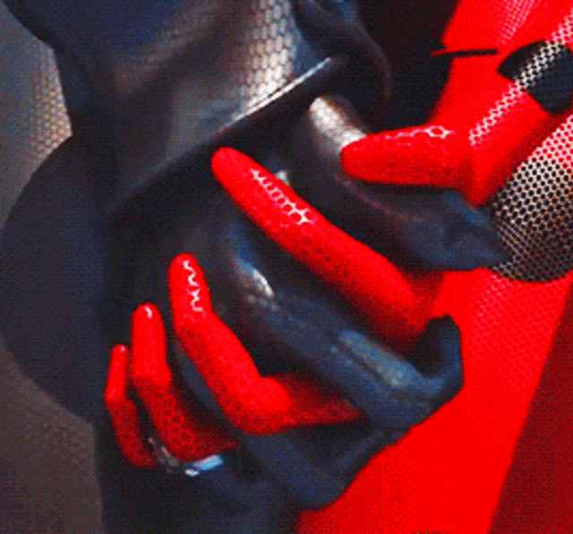 a statue of a woman in a black and red suit
