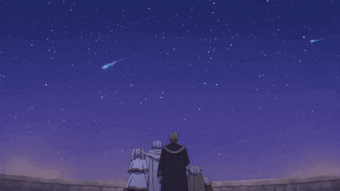 a group of people are looking up at a starry sky