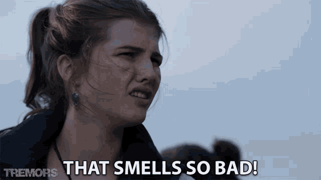 a woman says that smells so bad in front of a group of people