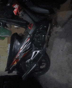 a honda motorcycle is parked in a dark room