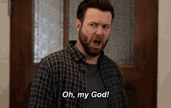 a man with a beard is standing in front of a door and saying `` oh , my god ! ''