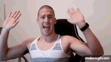 a man in a tank top is making a funny face