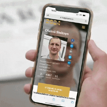 a person is holding a phone that says oleksii sinitsyn on it