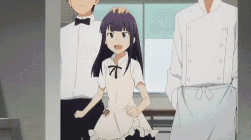 a girl with purple hair is standing next to a man in a chef 's jacket