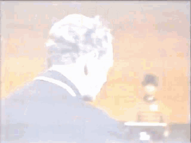 a man 's face is shown in a blurry photo