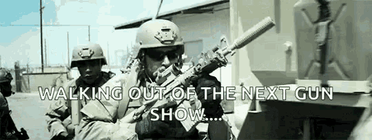 a group of soldiers are walking out of a next gun show