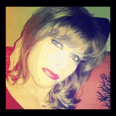 a close up of a woman 's face with red lipstick