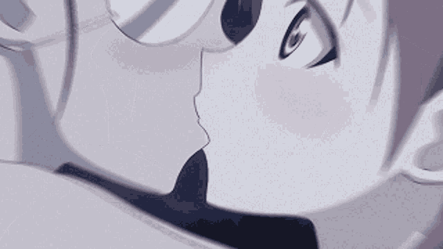 a close up of a person kissing another person 's cheek