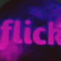 a blurred image of the word flick in purple letters .