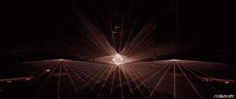 a close up of a purple light coming out of a hole in a dark room .