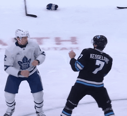 two hockey players are fighting on the ice in front of a utah logo