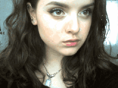 a woman with a nose ring and a necklace