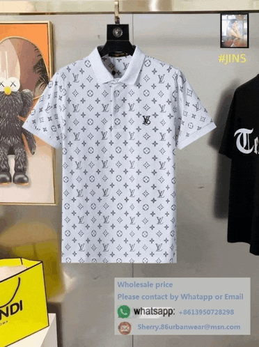 a white louis vuitton polo shirt hangs on a hanger