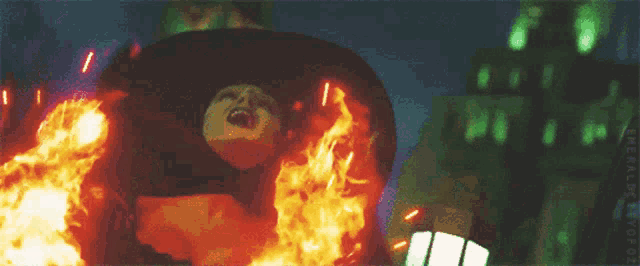 a picture of a person in a fire with the words emerald city on the bottom