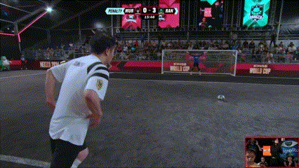 a man is kicking a soccer ball in front of a scoreboard that says penalty at the top
