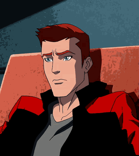 a cartoon character with red hair and blue eyes is sitting on a chair