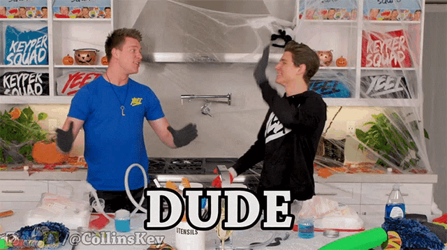 two men are standing in a kitchen with the word dude on the bottom