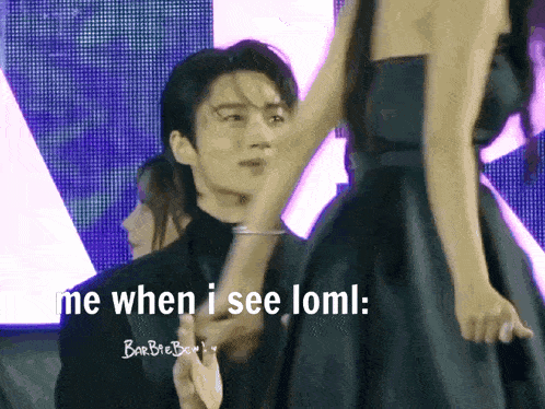 a man holding a woman 's hand with the words " me when i see loml " below him