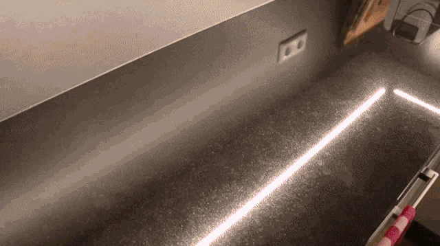 a kitchen counter with a light on it