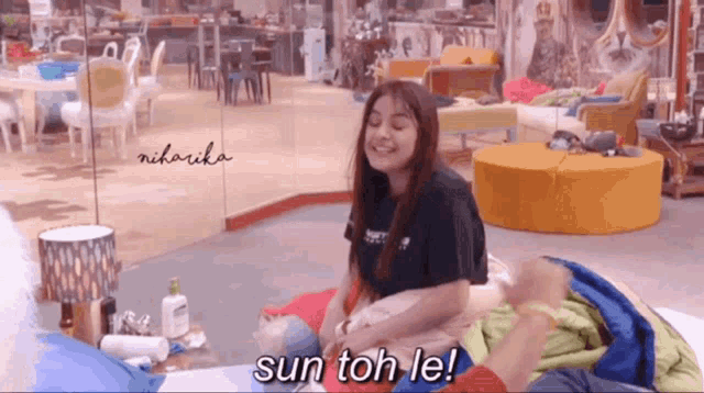 a woman is sitting on the floor with the words sun toh le written on the bottom