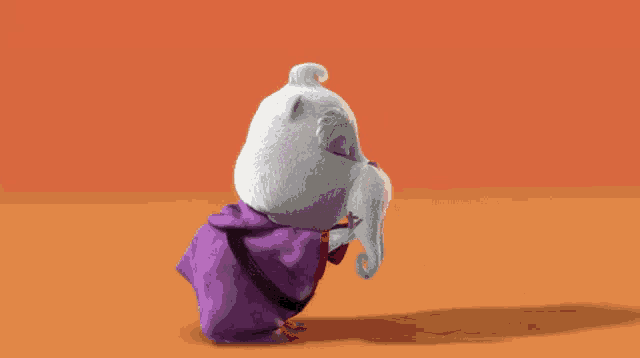 a cartoon character is wearing a purple cape and has a beard
