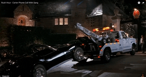 a tow truck is pulling a black car with the words rush hour on the screen