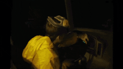 a blurry image of a person sitting in a chair
