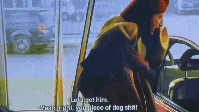 a man standing in front of a car with the words let 's get him yeah right you piece of dog shit on the bottom