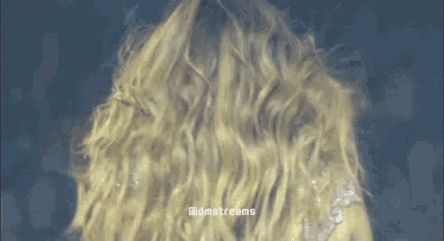 a close up of a woman 's hair with the words @dmstreams written on the bottom