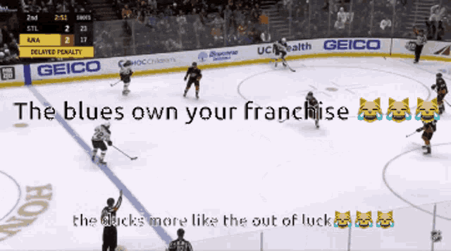 a hockey game is being played with advertisements for geico